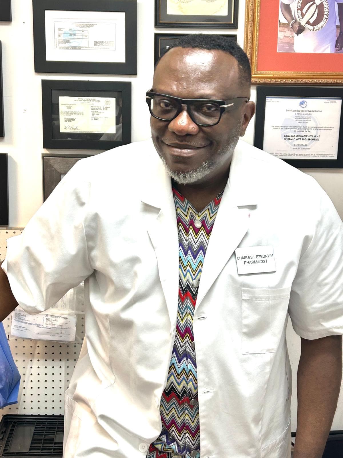 Pharmacist Charles Ikenna Ezeonyim with his pharmacy credentials and certifications